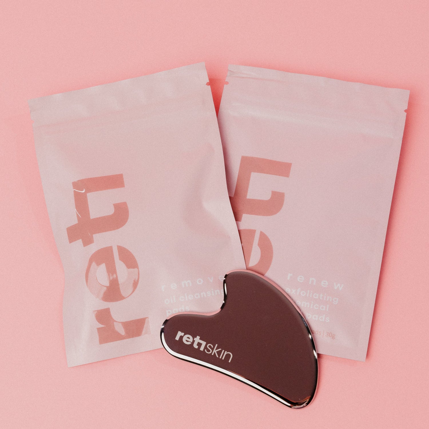 travel sized packs of cleansing oil pads and chemical peel pads with stainless steel gua sha