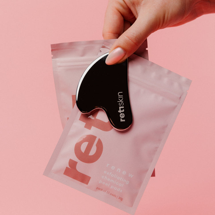 Chemical peel pads with cleansing oil pads in travel sized packs and stainless steel gua sha