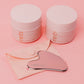 a gua sha tool with two jars of cleansing oil pads and chemical peel pads